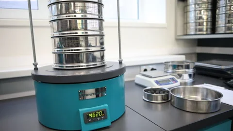 Sieve shaker in the testing laboratory Stock Footage 99179557