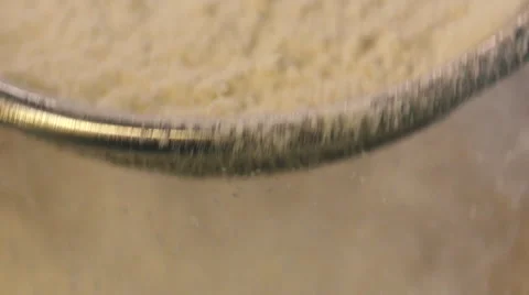 Sieving flour close up slow motion Stock Footage 54143034