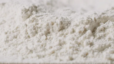 Sieving flour macro shot, isolated Stock Footage 128492741