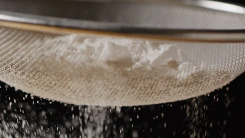 Sieving flour macro shot, isolated Stock-Footage 128492780