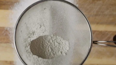 Sieving flour macro shot, isolated Stock Footage 128492845