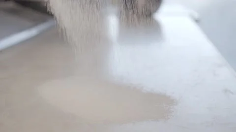 Sieving Flour Onto A Work surface. 2 Slow Motion shots. Stock Footage 60928286