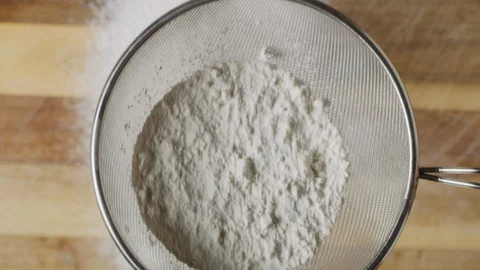 Sieving sugar powder macro shot Stock Footage 128492969