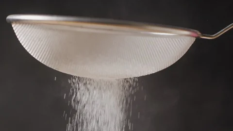 Sieving sugar powder macro shot Stock-Footage 128493018