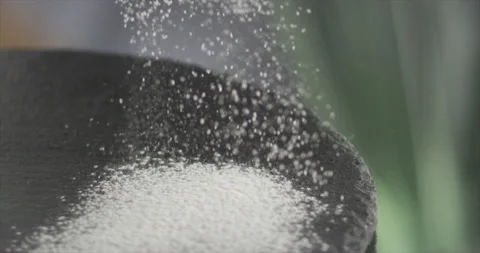 Sift flour on a black surface Stock Footage 200255074