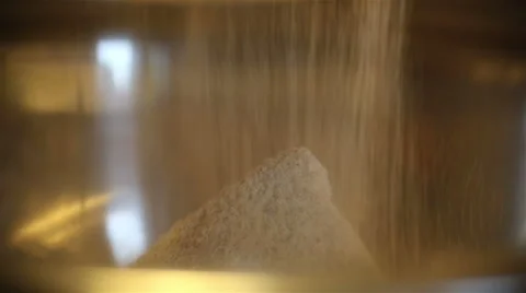Sift the flour into mixing bowl. Making Puff Pastry Stock Footage 67879099