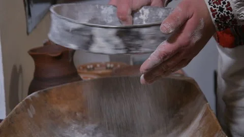 Sift flour through a sieve Stock Footage 145376086