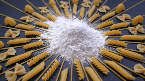 Sifted Flour Falls on Table with different type of pasta. Stock Footage 119723036