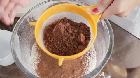 Sifting Chocolate Powder Stock Footage 10836533