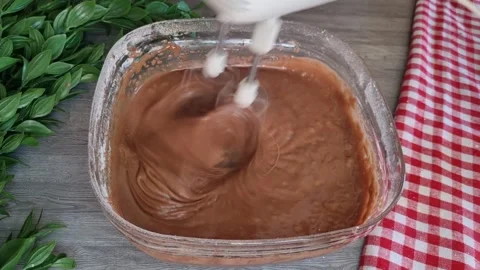 Sifting Flour and Cocoa Powder into Cake Batter - Chocolate Cake Preparation Stock Footage 346524969