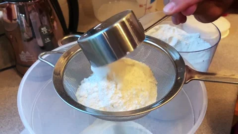 Sifting Flour to Bake Bread at Home Stock Footage 134183547