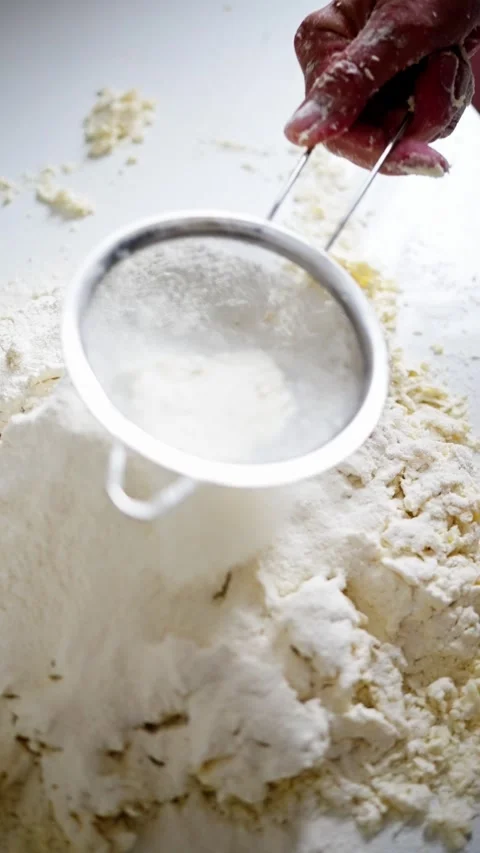 Sifting Flour for Baking Essential Techniques for Light and Airy Results in Your Stock Footage 314619029