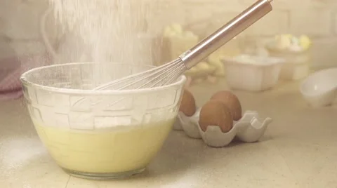 Sifting flour into bowl on table Stock Footage 57319652