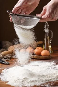 Sifting flour with flour filter. Making cookies A chef making cookies. The first Stock Photos
