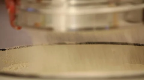 Sifting flour Stock Footage 54429054