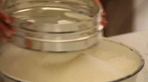 Sifting flour Stock Footage 54429649