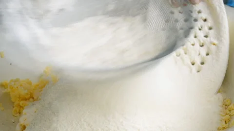 Sifting flour Stock Footage 157009844