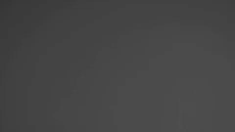 Sifting flour on a gray background Stock-Footage 84602230