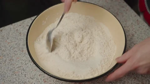 Sifting flour, making sinnabon buns. Stock Footage 166501807