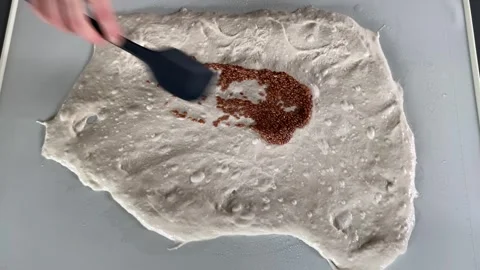 Sifting flour over dough Stock Footage 341983184