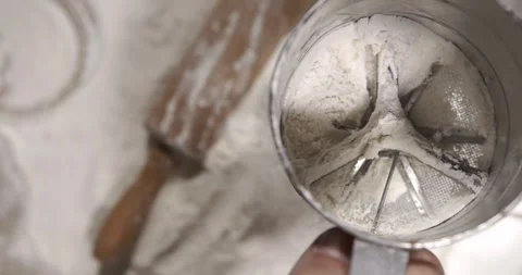 Sifting flour in slow motion Video stock 344985652