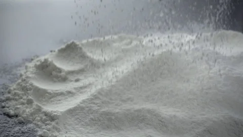 Sifting flour. Slow motion shot of wheat flour heap Stock Footage 72730892