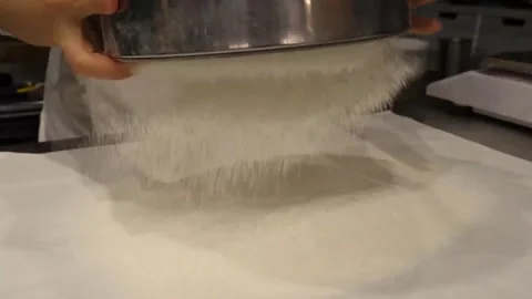 Sifting Flour through Sieve on Baking Paper in Commercial Kitchen 스톡 동영상 345291373