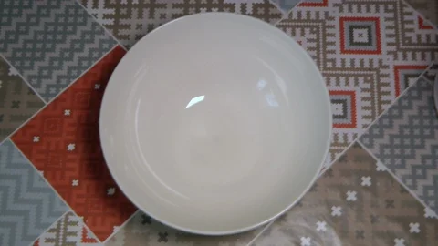 Sifting flour through sieve. Black background. Video stock 87185001