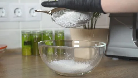 Sifting flour through a sieve. Coocking. Stock Footage 126771499