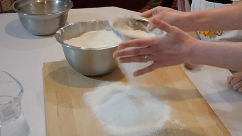 Sifting flour through sieve Stock Footage 95831264