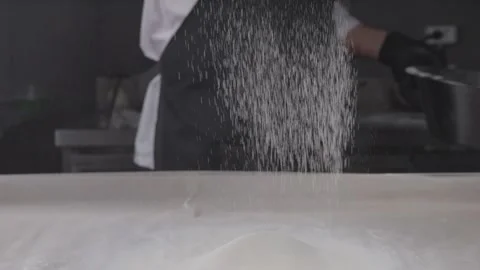 Sifting flour through a sieve. Stock Footage 314241929