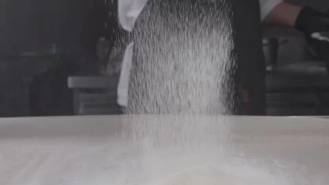 Sifting flour through a sieve. Stock Footage 314971424