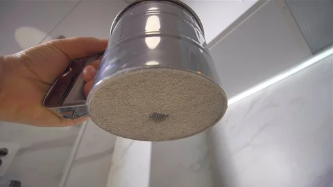 Sifting the flour through a sieve. Making pancakes. Stock Footage 113058255