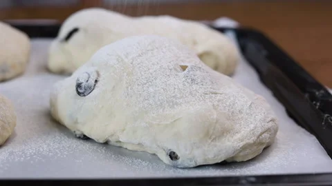 Sifting flour through a sieve over dough close up Stock Footage 160145845