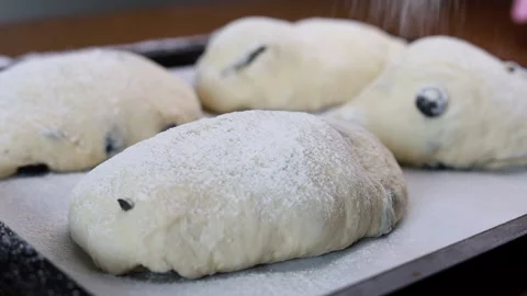 Sifting flour through a sieve over dough Stock Footage 160146023