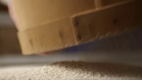 Sifting flour through a sieve side view. Video Stock Footage 85322796