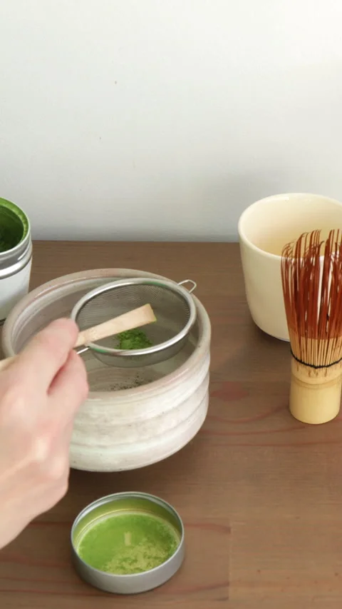 Sifting matcha powder. Step of preparation ceremonial matcha tea, minimalis.. Stock Footage 323293641