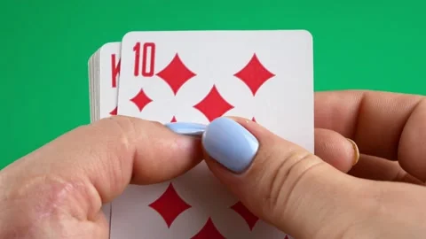 Sifting through a deck of cards.Gambling and entertainment.Four suits on hand. Stock-Footage 132948638