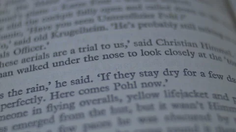 Sifting trough a book [single page focus pull] Stock Footage 62915658