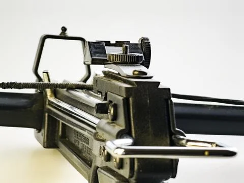 Sight of a Black training crossbow on a white background. Close-up. Stock Photos