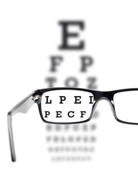 Sight test seen through eye glasses Stock Photos