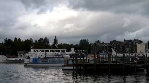Sightseeing boat backs away from dock Bowness Bay-Lake Windermere England Stock Footage 96161718