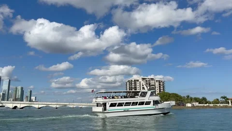 Sightseeing boat, cruise sails in front of Venetian Islands. Miami, Florida Stock Footage 332501603