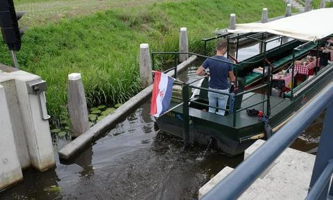 A sightseeing boat going out a lock 写真素材