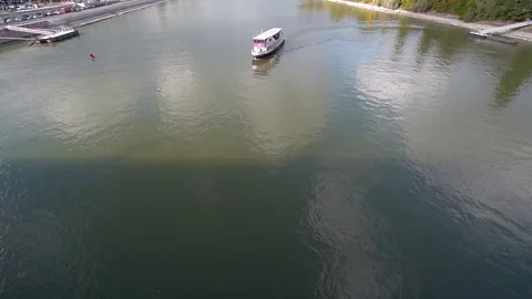 Sightseeing boat on the river from birds view Stock Footage 70453142