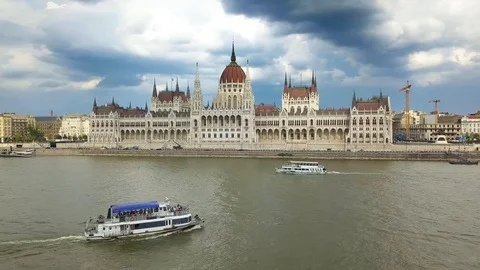 Sightseeing boat on River Danube next to Hungarian Parliament Stock Footage 90905323