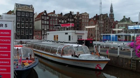 Sightseeing boats in the canals of Amsterdam Stock Footage