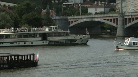 Sightseeing boats, passing under Manes Bridge (Mánesův most), Prague Stock Footage 55886924