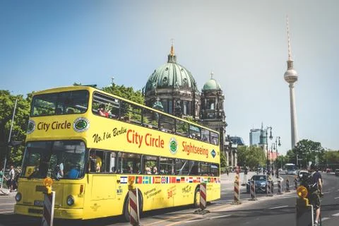 A sightseeing bus in famous landmarks - the Berlin Cathedral (Berliner Dom).. Stock Photos