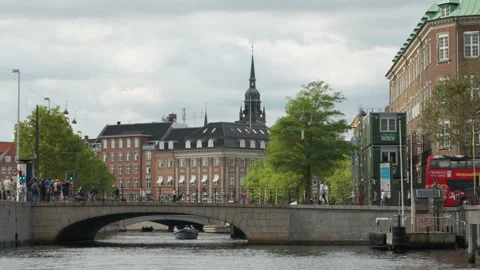 Sightseeing bus on Hojbro bridge over Slotsholmskanalen in Copenhagen Stock Footage 345590821